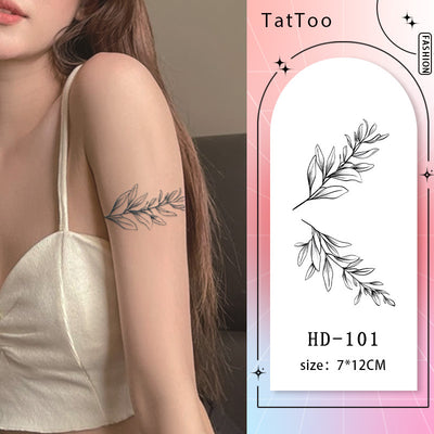 Elegant branch tattoo with falling green leaves design, featuring graceful lines and delicate details for a balanced, natural look.