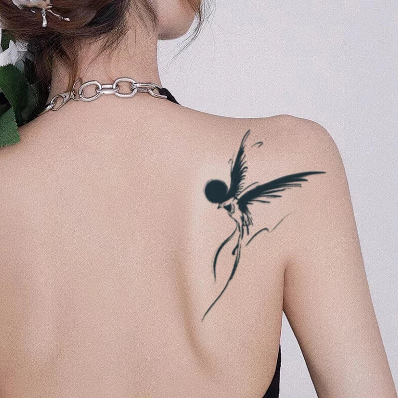 Eco-friendly hummingbird temporary tattoo on back, perfect for arm sleeve, showcasing natural beauty and elegance, gentle on skin.