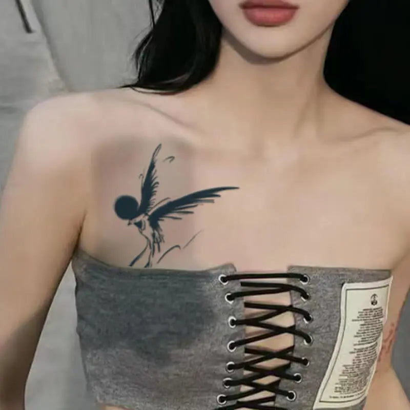 Woman with elegant hummingbird temporary tattoo on shoulder, perfect for back or arm sleeve, made from eco-friendly materials.